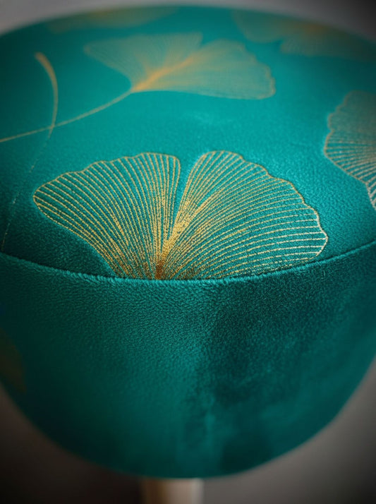 Detalle del tapiz del puff verde, vista superior con textura